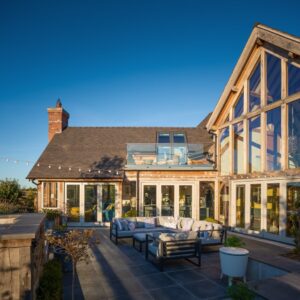 modern floor to ceiling glazing on oak framed home