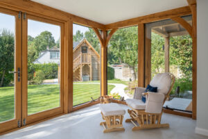 Bespoke Oak Frame House & Extension. Glazed 2 storey oak extension
